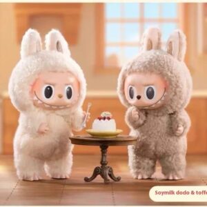 cute banny plush toys sitting at table with a cake, soft stuffed animal dolls for kids